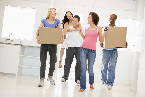 Packed boxes and furniture prepared for collection by removals van