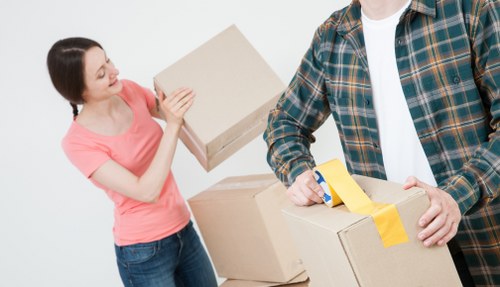 Professional movers loading items for a Haringey house relocation