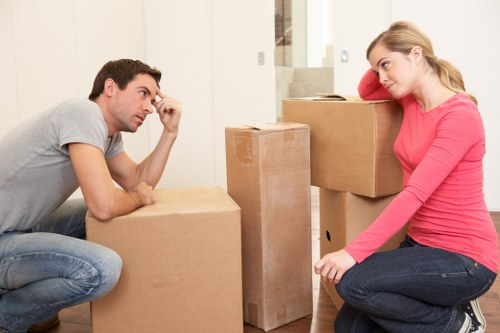 Removal workers following health and safety procedures during loading