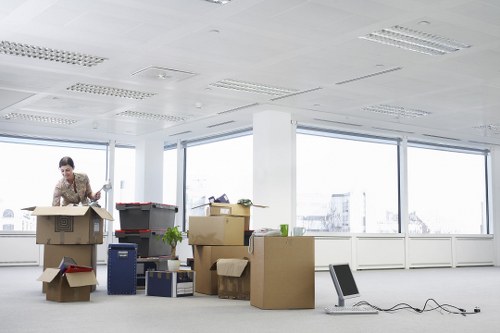 Office relocation setup with labelled boxes and furniture placement
