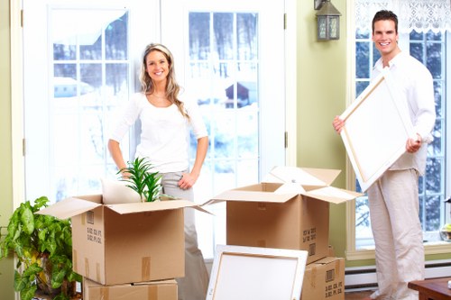 Removal staff loading items safely
