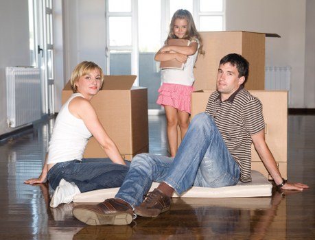 Furniture and boxes being unloaded at a new home in Haringey