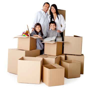 Movers handling desks and office items in a commercial workspace